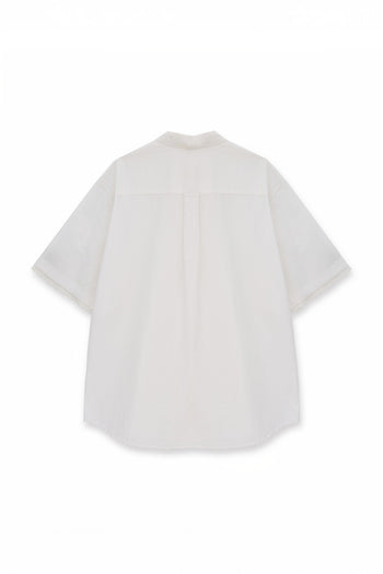 EUNJO oversized Icing shirt featuring a casual fit and stylish design, displayed on a hanger against a plain background.