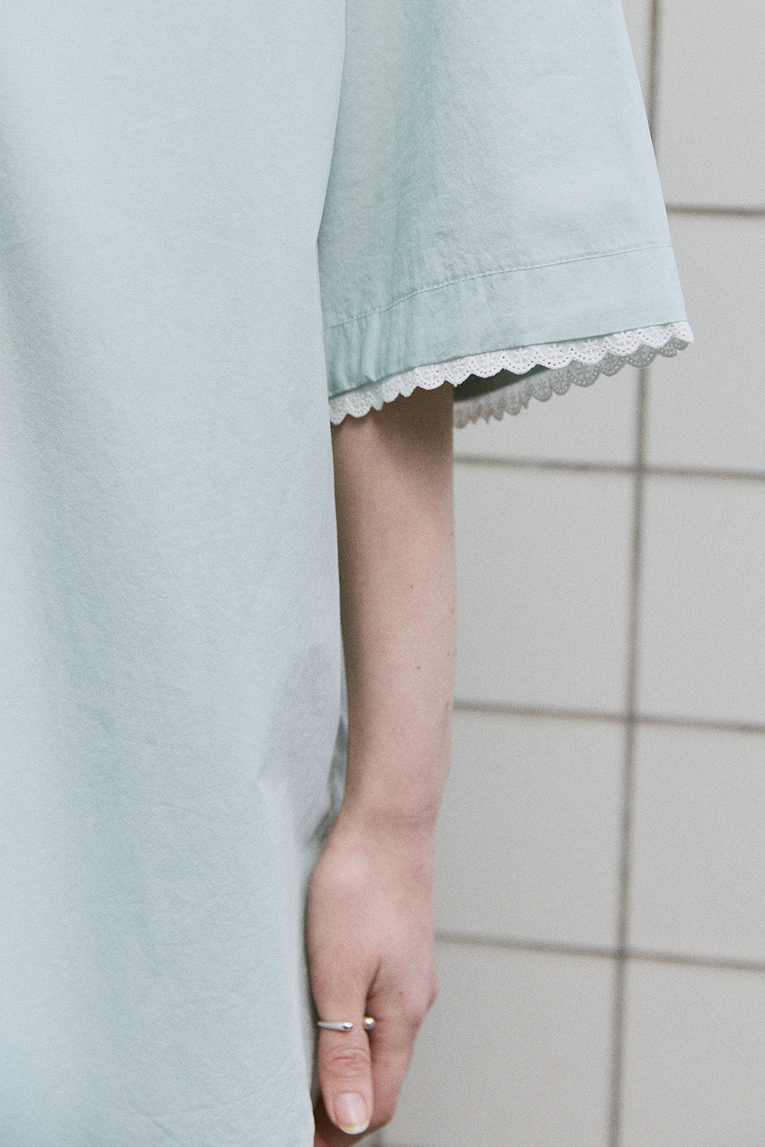 EUNJO Icing oversized shirt in sky blue, casual fit, featuring bold icing graphic design on front, laid flat.