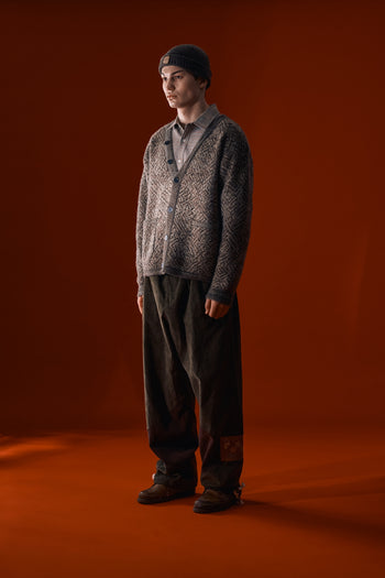 Brown IOEDLE flowing landscape short beanie showing a cozy knit fabric and relaxed fit on a model.