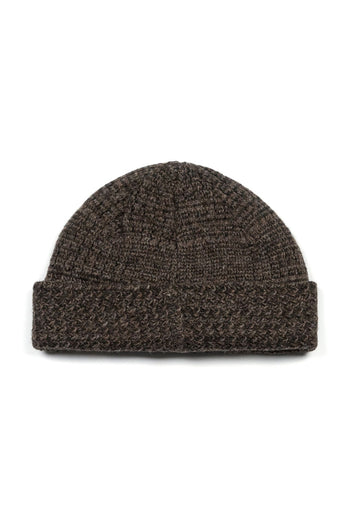 Brown IOEDLE flowing landscape short beanie, snug and stylish, shown on a model against a neutral background.
