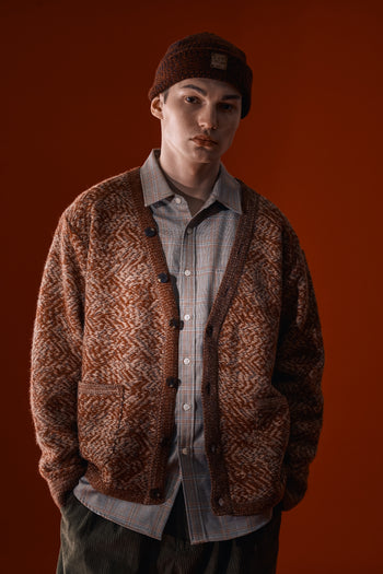 Red and brown flowing landscape short beanie by IOEDLE, featuring a cozy knit texture and snug fit.