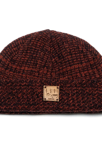 Red and brown flowing landscape short beanie by IOEDLE, shown in a close-up view highlighting its textured knit fabric.