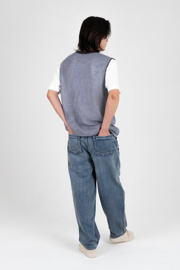 IOEDLE Koi Lake denim pants shown on model, featuring classic blue jeans style with a relaxed fit and five-pocket design.