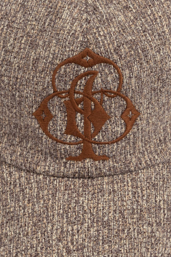 IOEDLE Clover Symbol Weaving Cap showing a casual cap with a prominent clover design on the front.