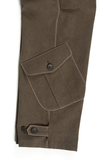 Brown dirt cargo pants from IOEDLE, styled with jacket fabric, featuring multiple pockets and rugged design.