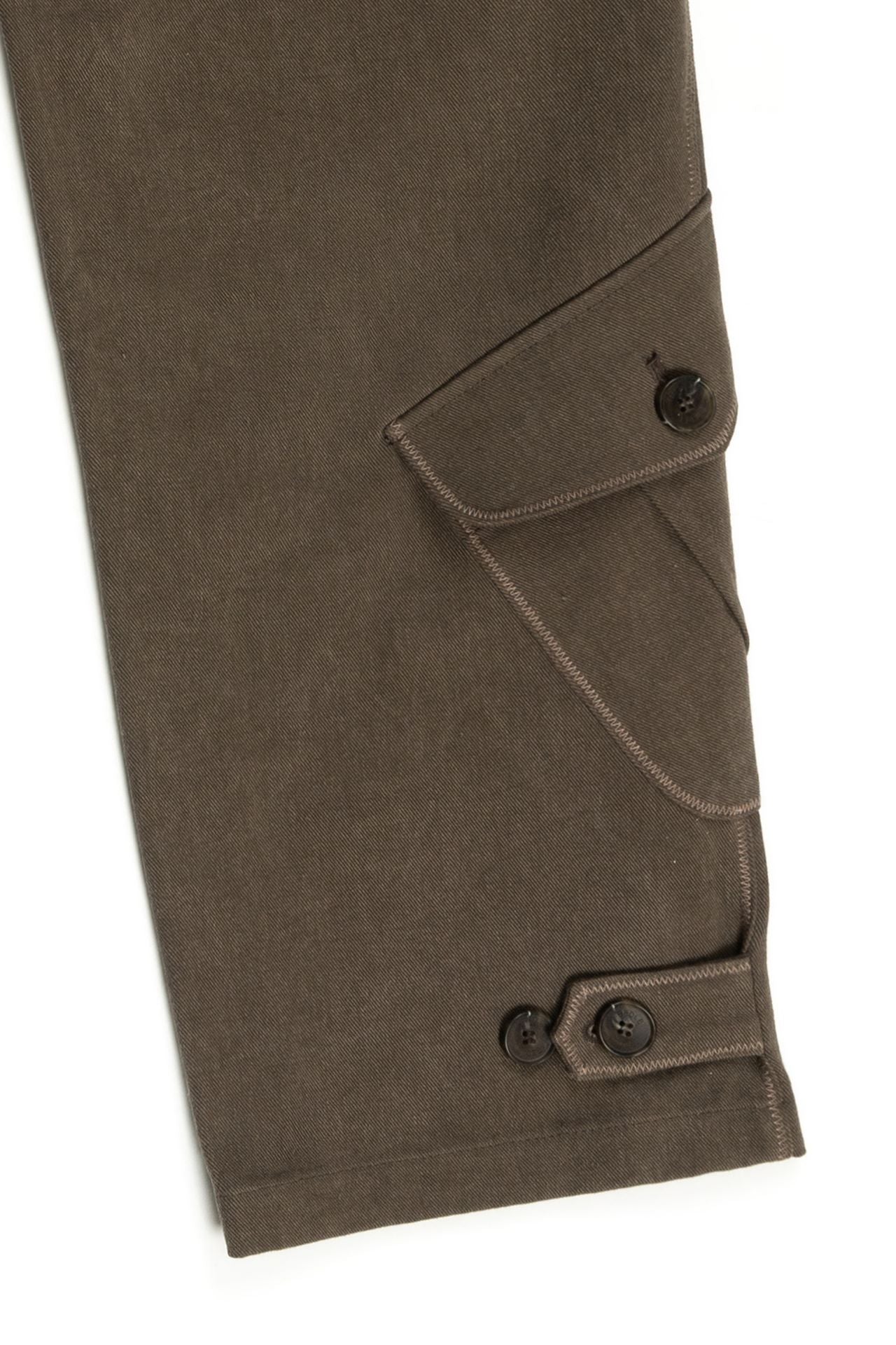 Brown IOEDLE Dirt Cargo Pants shown on a model, featuring multiple pockets and rugged design for outdoor and casual wear.