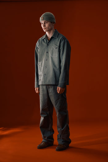 Green IOEDLE dirt cargo pants with multiple pockets and rugged design, suitable for outdoor and casual wear.