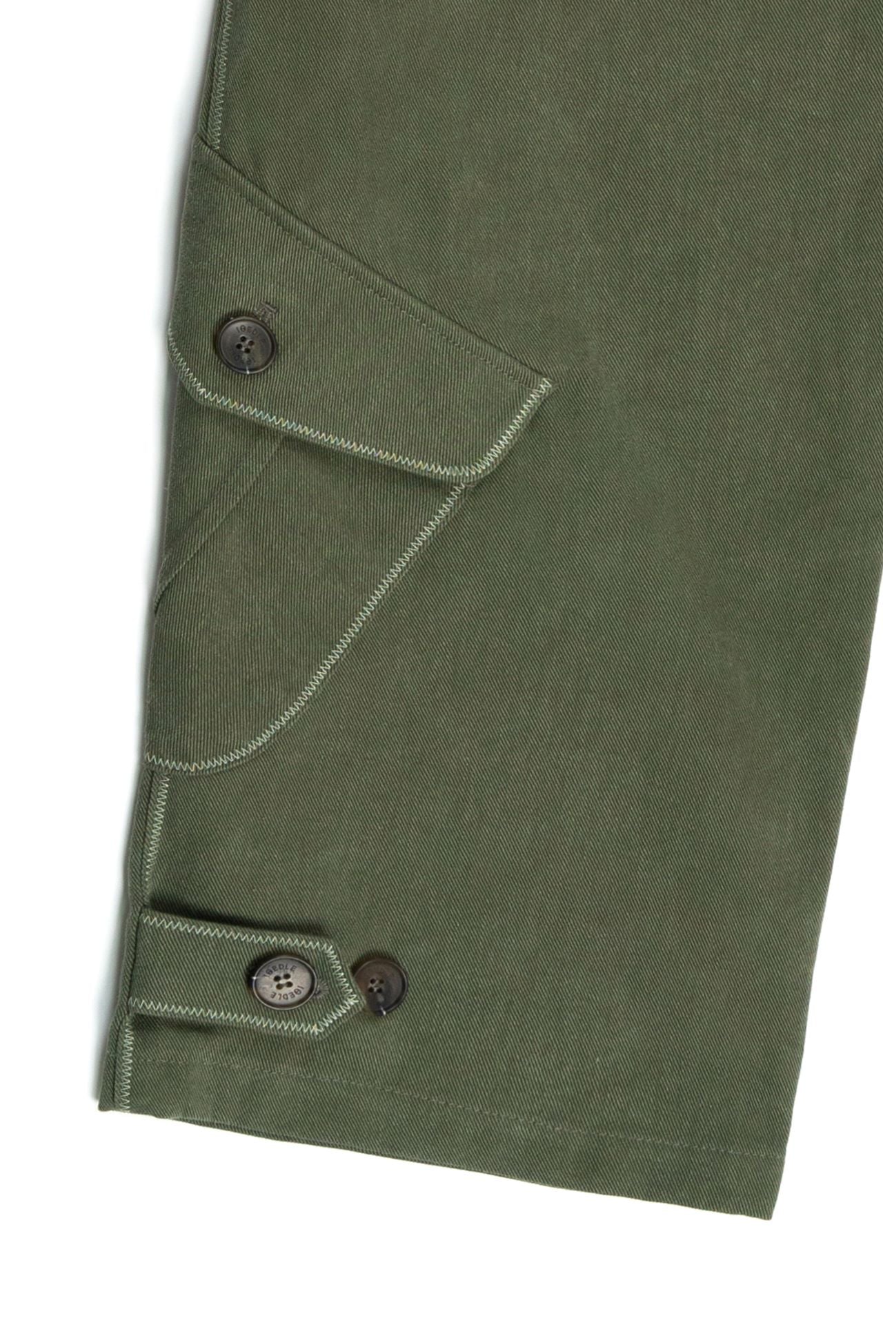 Green dirt cargo pants from IOEDLE, styled as rugged cargo pants with multiple pockets and durable fabric.