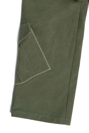 Green IOEDLE Dirt Cargo Pants worn as casual jacket, featuring multiple pockets and rugged outdoor style.