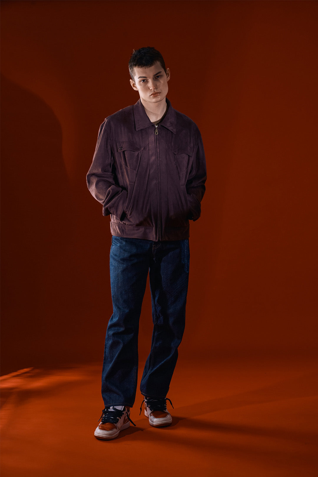 Brown Headlight Jacket by IOEDLE, stylish outerwear with a modern design, shown in a close-up of the jacket's front and collar.