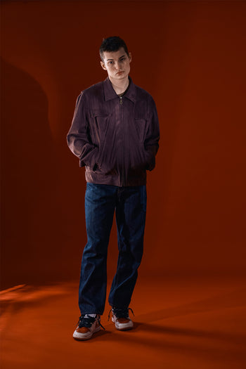 Brown Headlight Jacket by IOEDLE, stylish outerwear with a modern design, shown in a close-up of the jacket's front and collar.