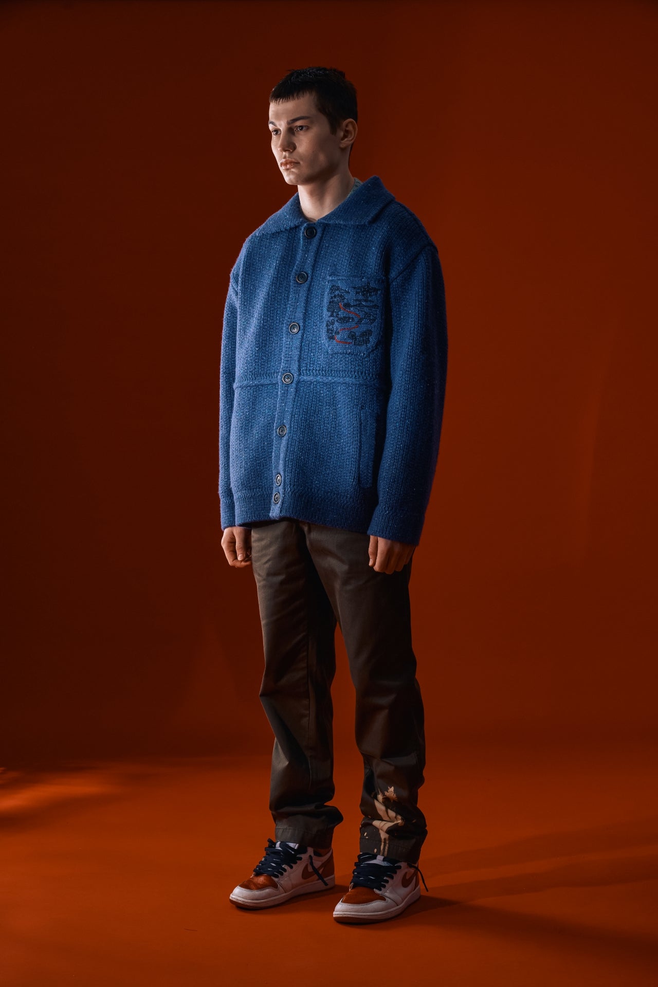 Blue IOEDLE Guide to Memories Knit Jacket showing front view with ribbed collar and cozy knit texture.