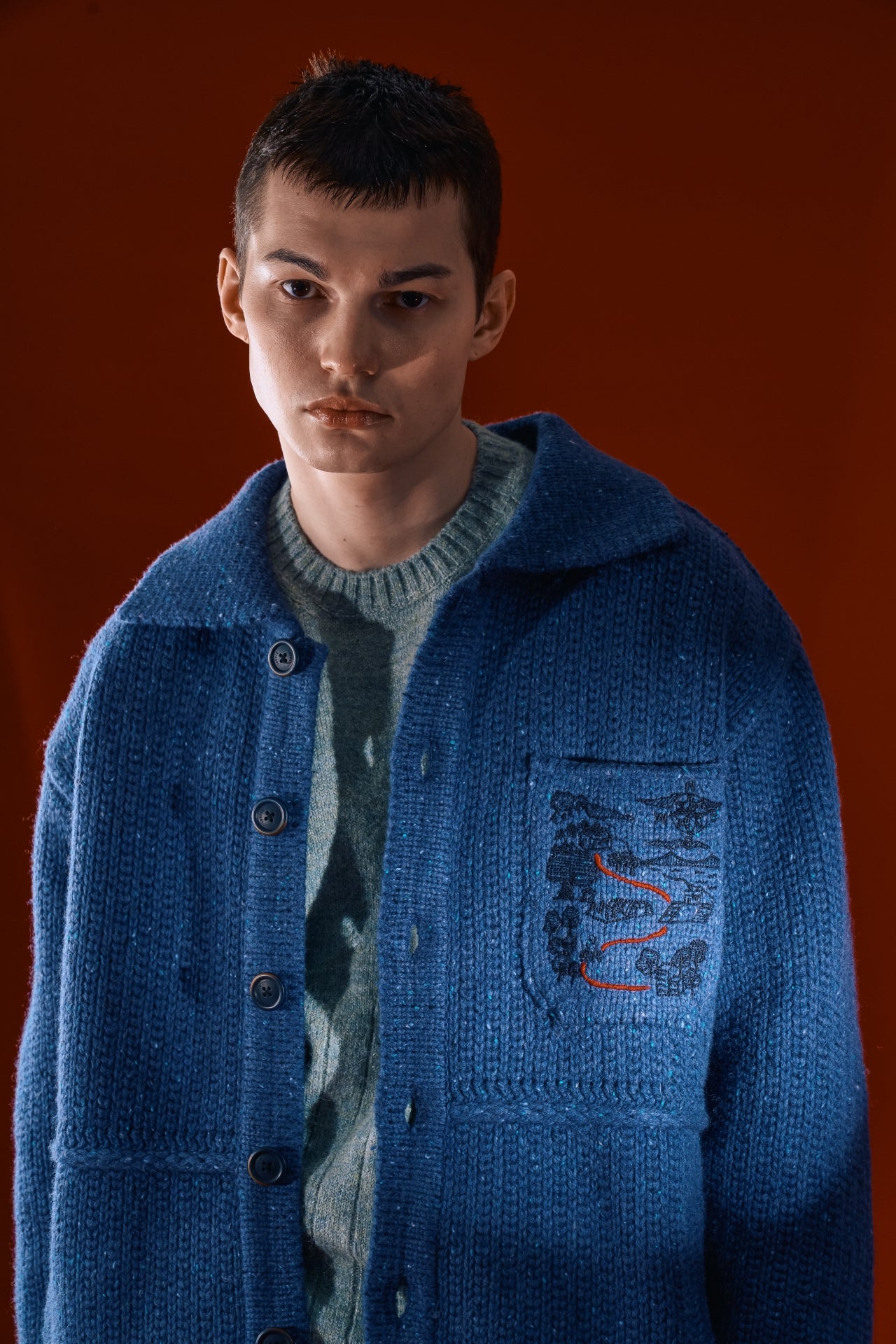 Blue Guide to Memories Knit Jacket by IOEDLE, featuring a cozy, stylish knit design with a comfortable fit and textured fabric.