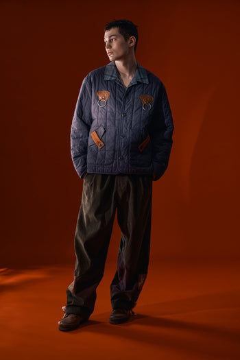 IOEDLE Welcoming Gate Quilted Jacket in charcoal, showcasing a stylish, padded jacket with a high collar and quilted design.