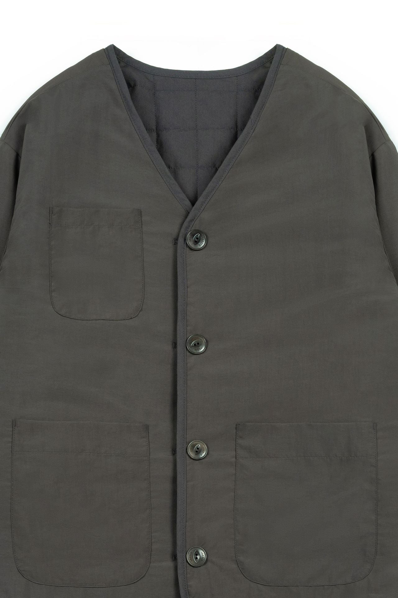IOEDLE Welcoming Gate Quilted Jacket in charcoal, front view showcasing the cozy, padded design and stylish collar.