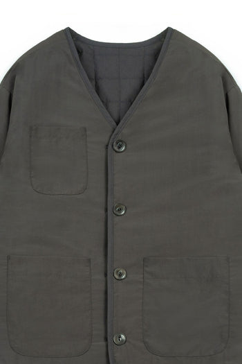 IOEDLE Welcoming Gate Quilted Jacket in charcoal, front view showcasing the cozy, padded design and stylish collar.