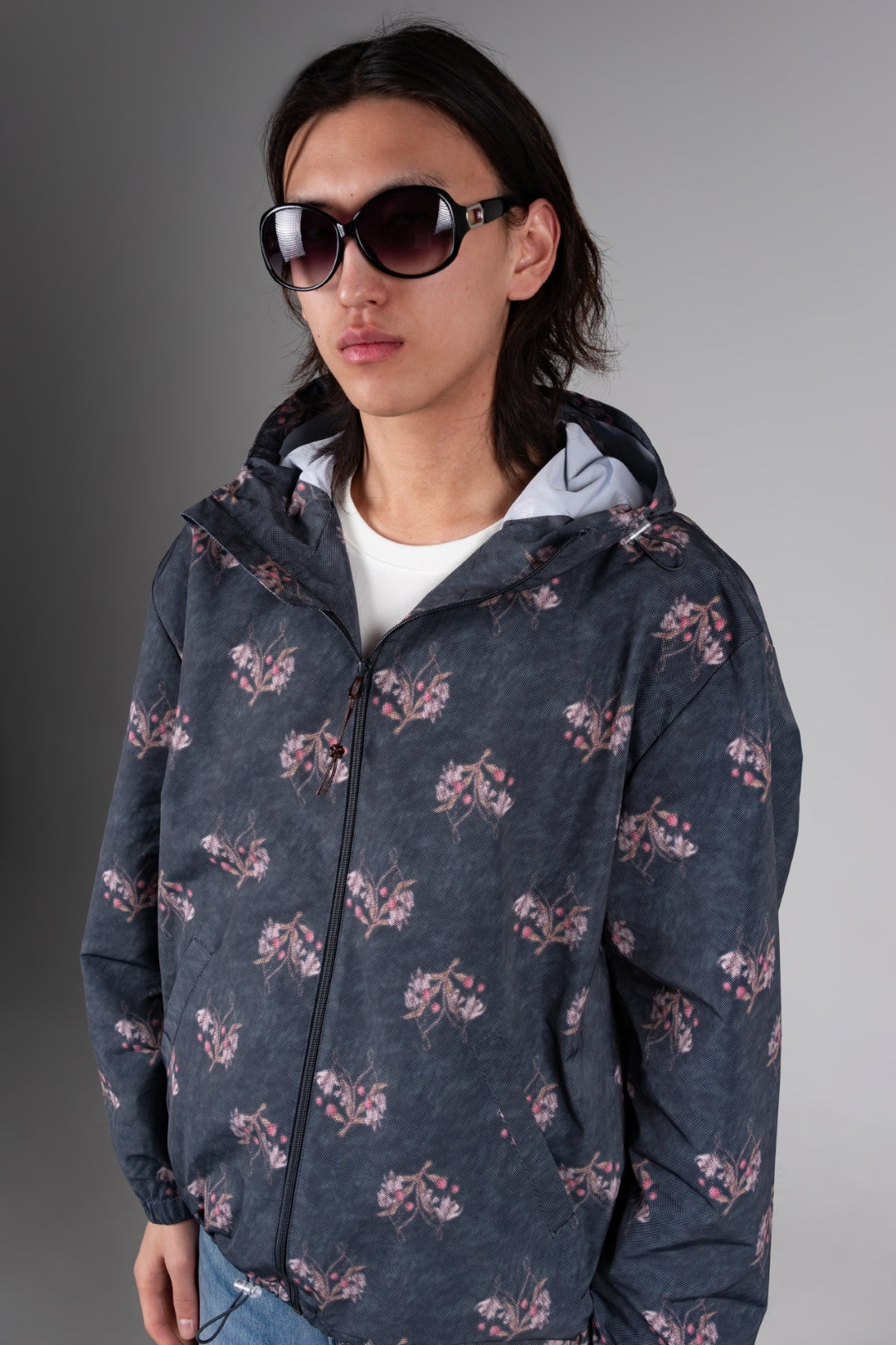 Dark grey IOEDLE flower graphic windbreaker jacket, lightweight windbreaker with floral design on the front.