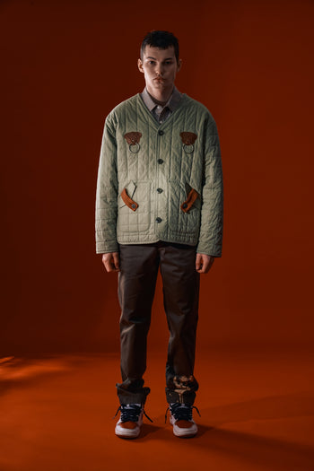 Olive green Welcoming Gate quilted jacket by IOEDLE, featuring a cozy design, front zipper, and padded texture for warmth and style.