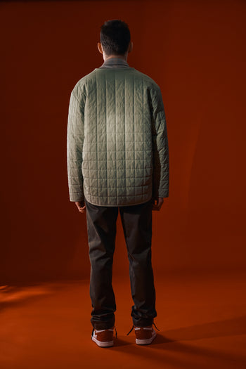 Olive quilted jacket from IOEDLE featuring a welcoming gate design, cozy padding, and a stylish, casual fit.