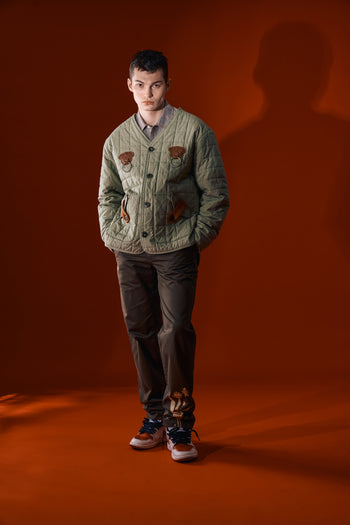 IOEDLE Welcoming Gate Quilted Jacket in olive green, showcasing the padded design and stylish collar for outdoor wear.