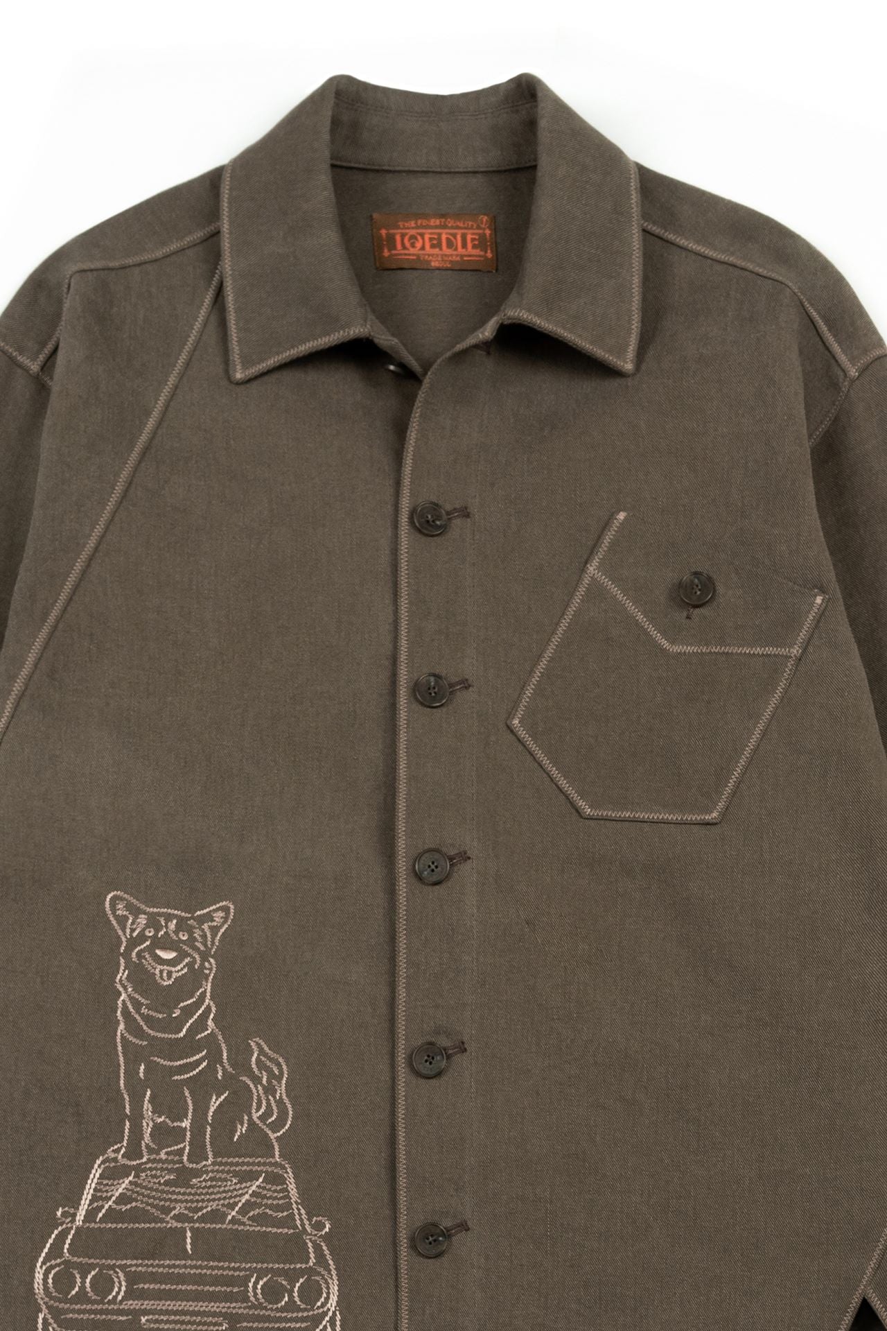 Brown IOEDLE diagonal landscape shirt featuring a geometric pattern, shown laid flat with long sleeves and collar.