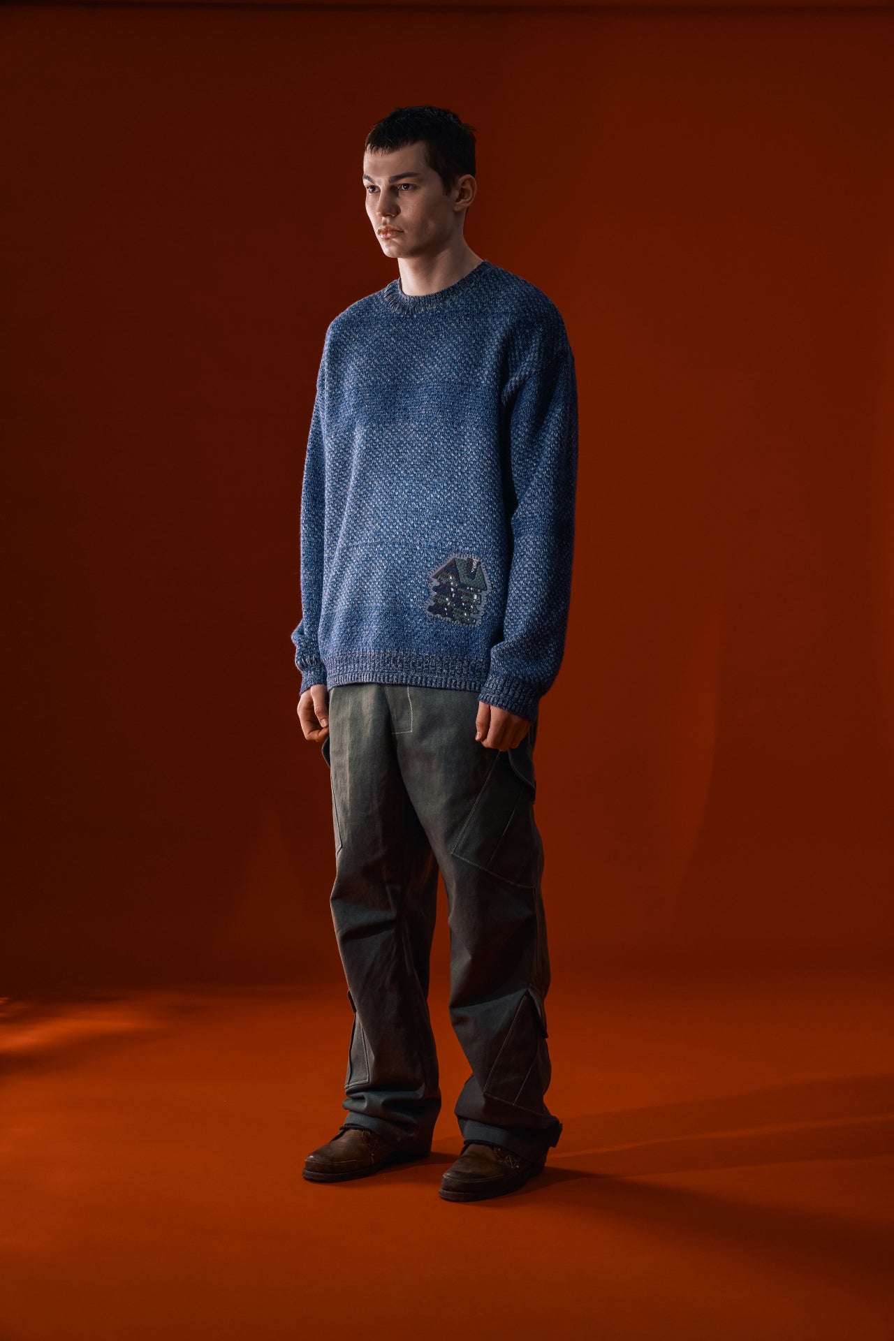 Navy IOEDLE House of Cars sweater with logo design, featuring soft knit fabric and a comfortable fit.