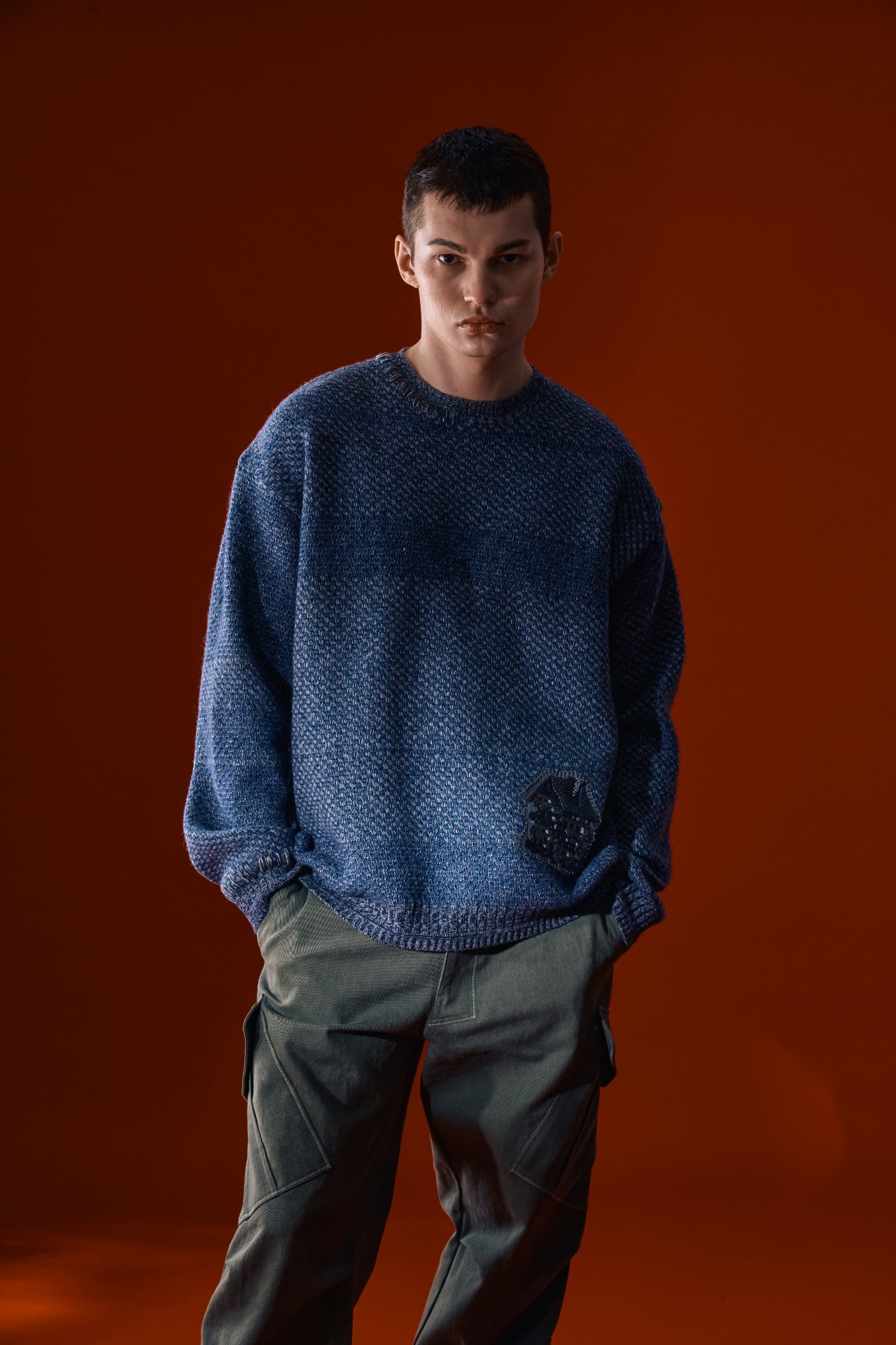 Navy IOEDLE House of Cars sweater featuring a cozy knit design and car-themed graphics on the front.
