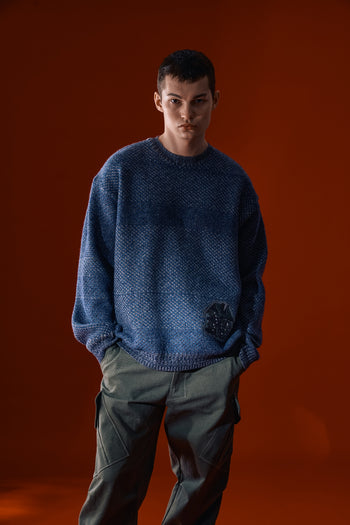 Navy IOEDLE House of Cars sweater featuring a cozy knit design and car-themed graphics on the front.