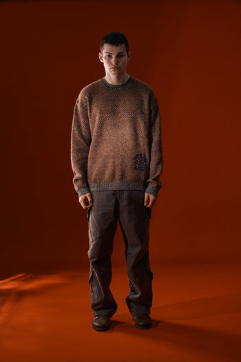 Red and brown IOEDLE House of Cars sweater displayed on a mannequin, showcasing a cozy knit design.