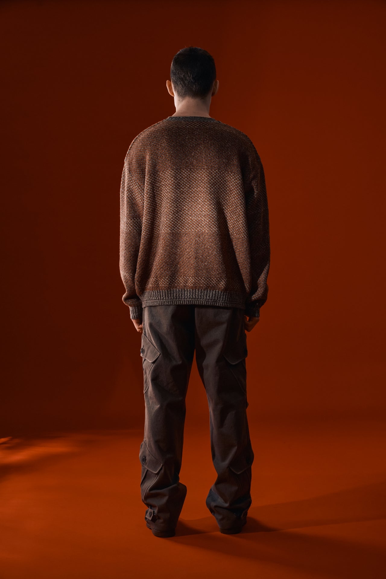 Red and brown IOEDLE House of Cars sweater, cozy knit with car-themed design, displayed on a neutral background.