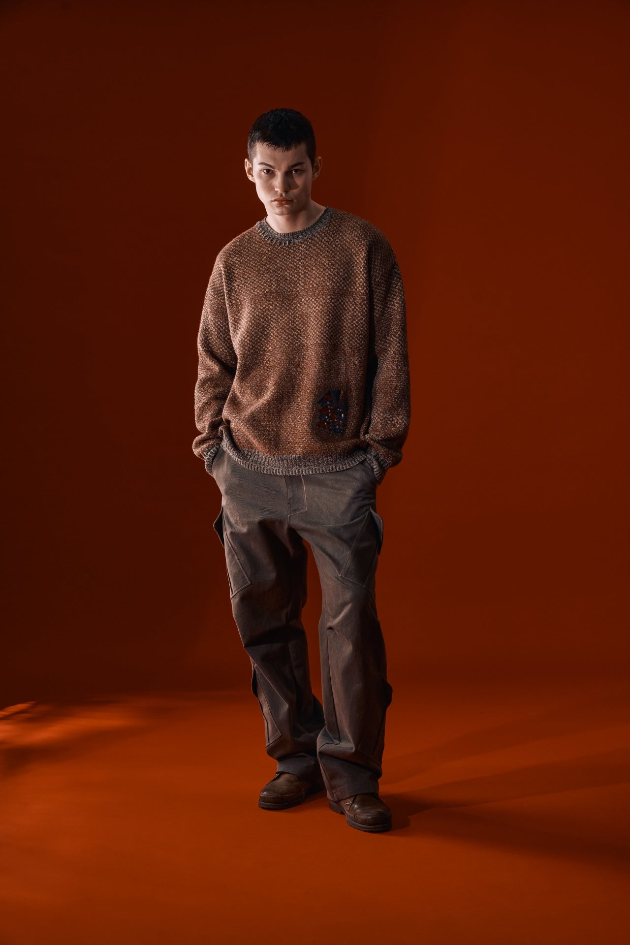 Red and brown IOEDLE House of Cars sweater, cozy knit with car-themed design, displayed on a mannequin.