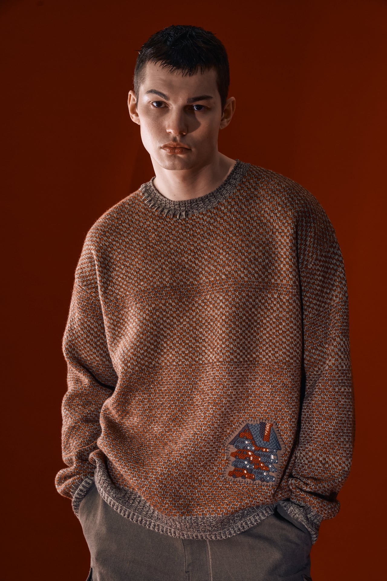 Red and brown House of Cars sweater by IOEDLE, featuring a stylish design and cozy knit fabric.