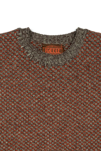 Red and brown IOEDLE House of Cars sweater, cozy knit with car-themed design, displayed on a hanger.