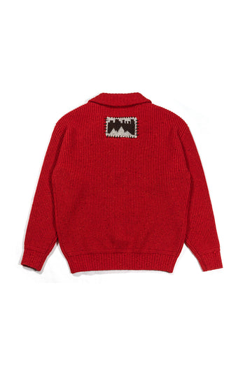 Red IOEDLE Concrete Jungle sweatshirt featuring a bold urban jungle print, made from comfortable sweatshirt fabric.