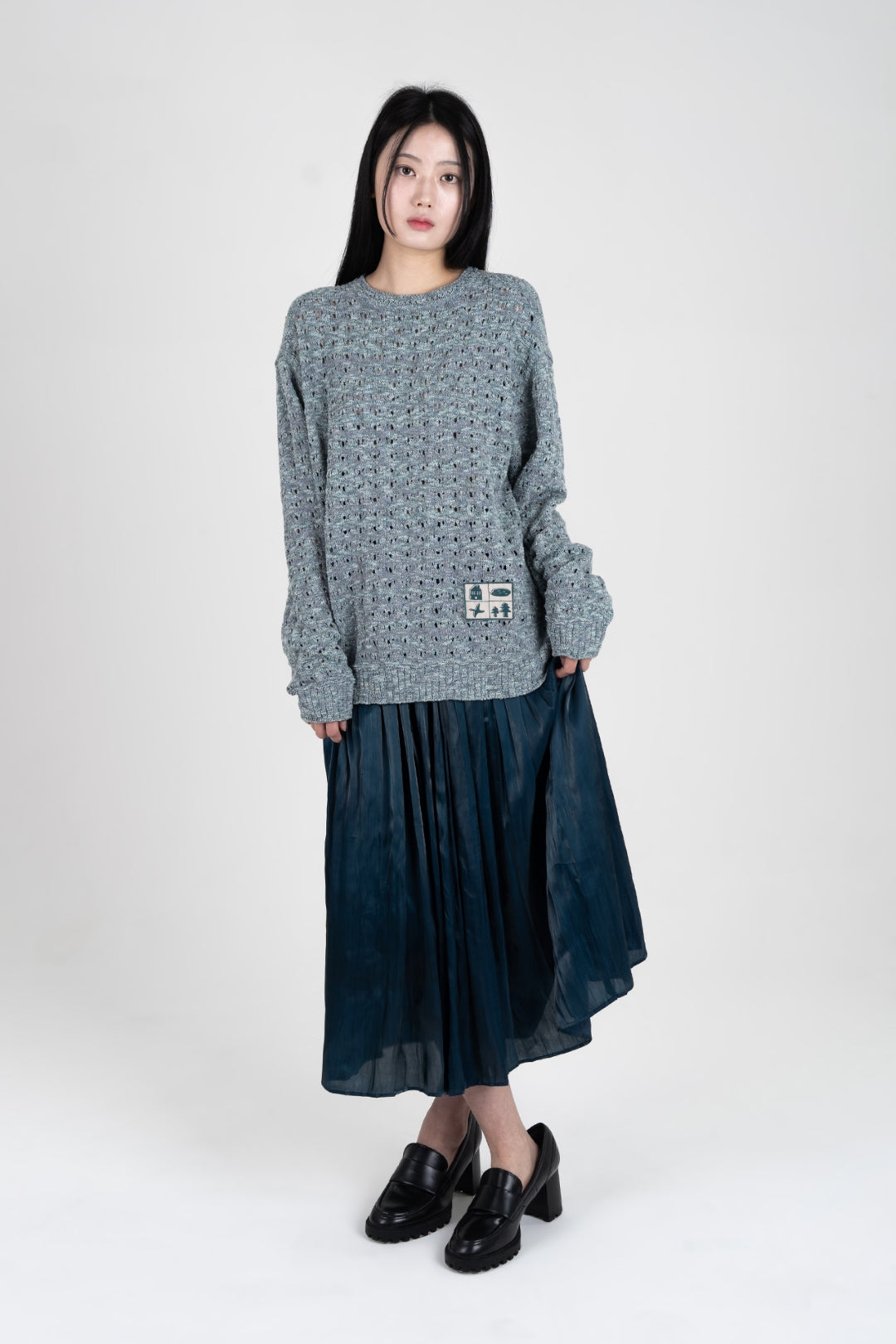 Blue mesh-knit sweatshirt by IOEDLE, featuring a stylish Beyond The Glass design, displayed on a plain background.