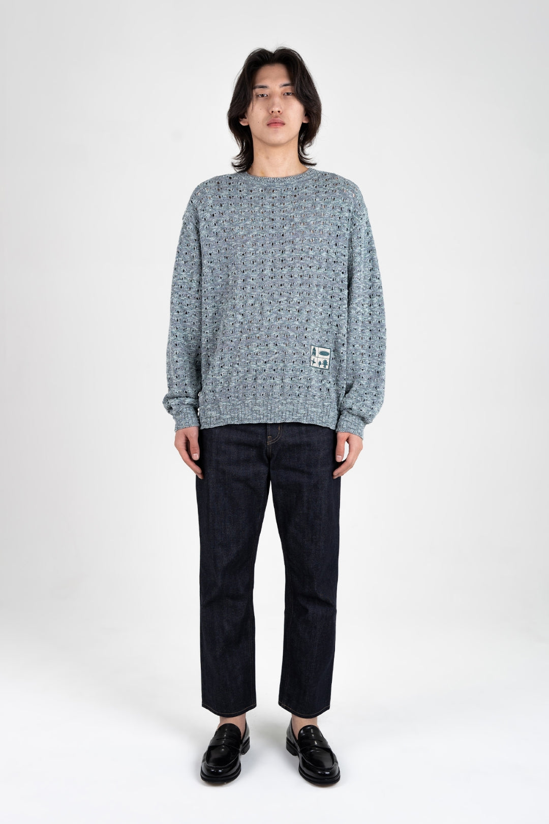 Blue mesh knit sweatshirt by IOEDLE, featuring a casual fit and textured fabric, styled with long sleeves and a round neckline.