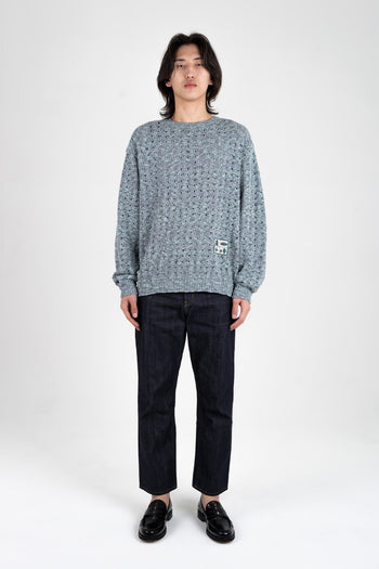 Blue mesh knit sweatshirt by IOEDLE, featuring a casual fit and textured fabric, styled with long sleeves and a round neckline.