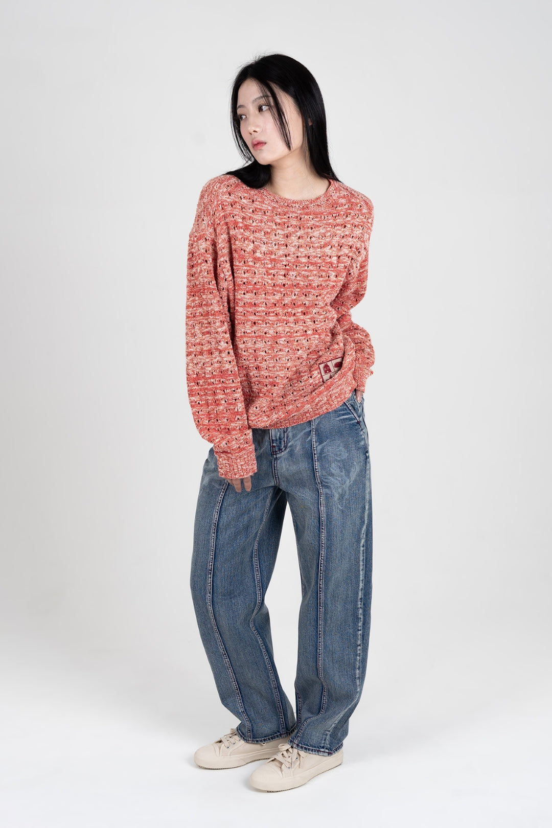 Red mesh knit sweatshirt by IOEDLE featuring a stylish Beyond The Glass design, shown on a model.