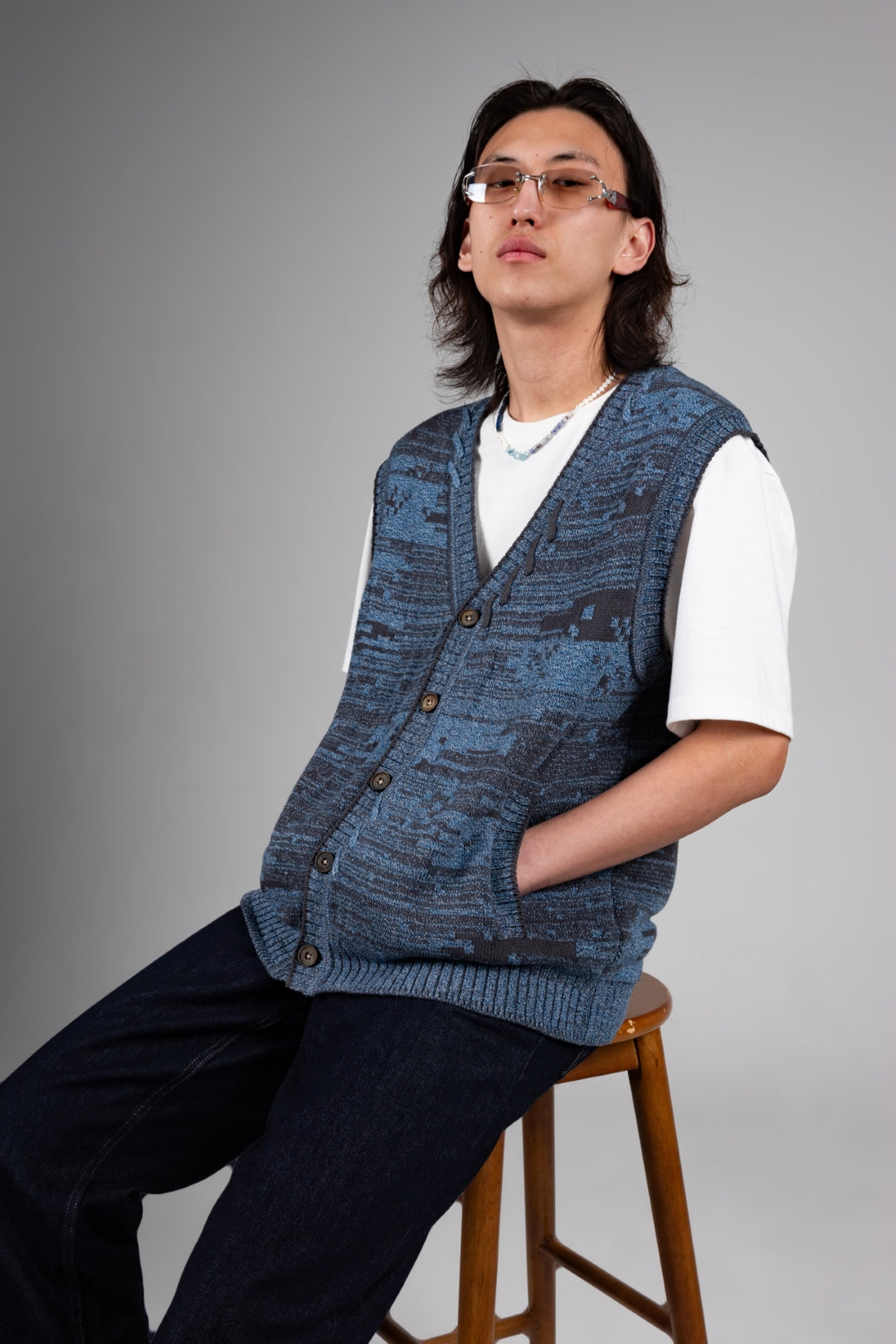 Blue Mosaic City Knit Vest Cardigan by IOEDLE, featuring a textured knit pattern and sleeveless design for casual tops.