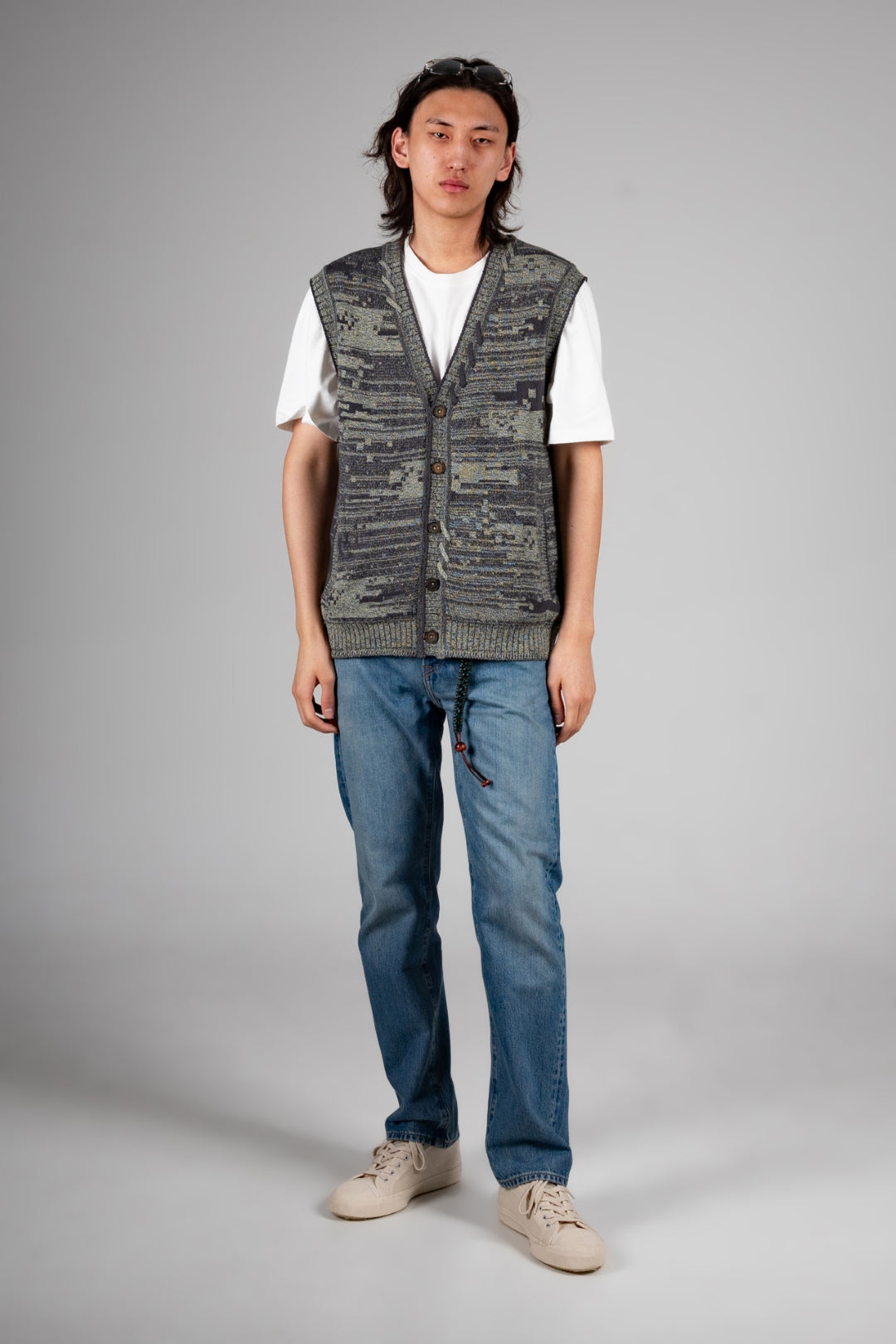 Green Mosaic City knit vest cardigan by IOEDLE, featuring a textured knit pattern and sleeveless design, perfect for layered tops.