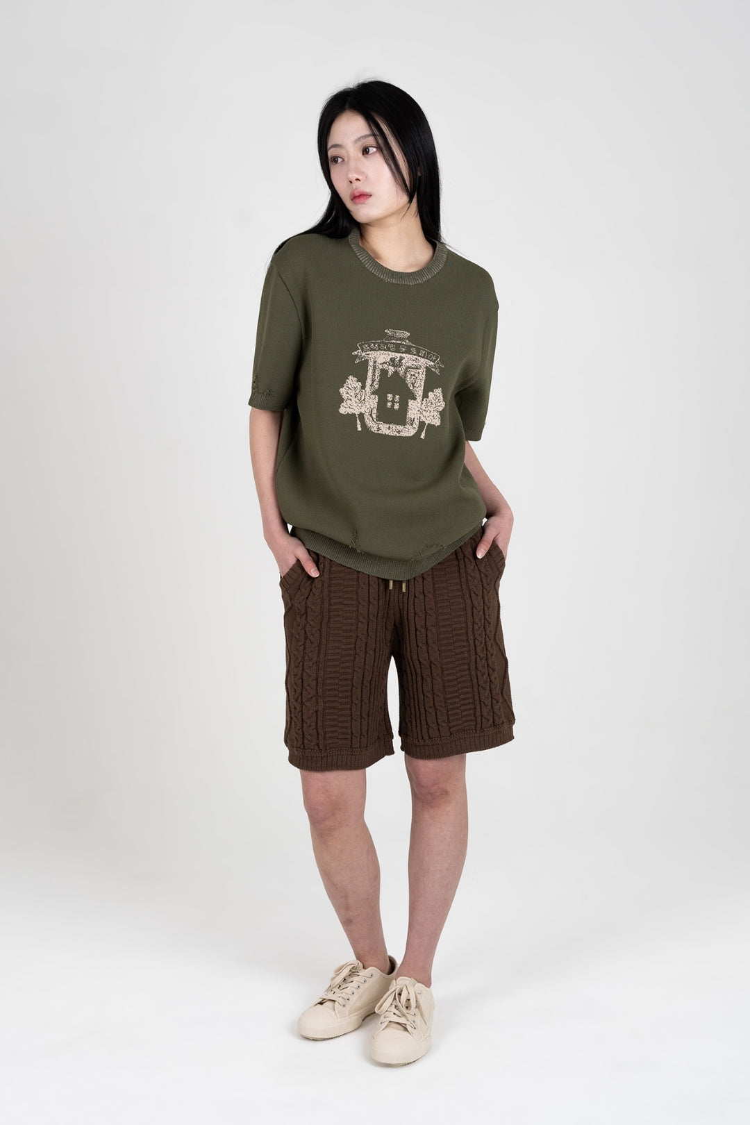 Khaki knitted top from IOEDLE's Practical Utopia collection, featuring a comfortable, stylish design and textured fabric.