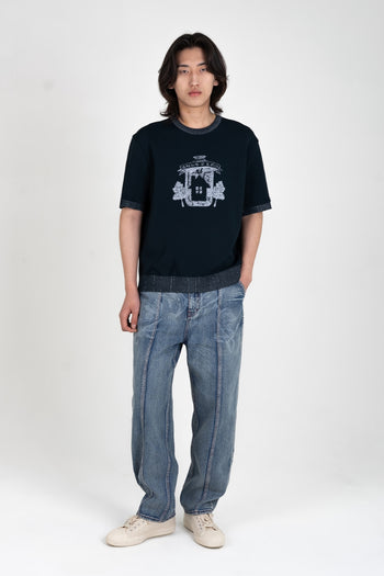 Navy Practical Utopia knitted top by IOEDLE, featuring a cozy, textured knit fabric and a casual fit, displayed on a model.