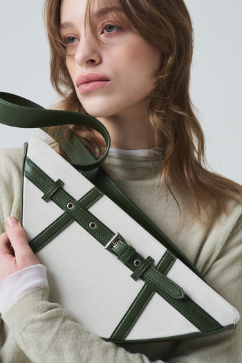 Green LE SAUT GOCHI bag with a compact, stylish design, featuring a small, versatile bag with a sleek, modern look.
