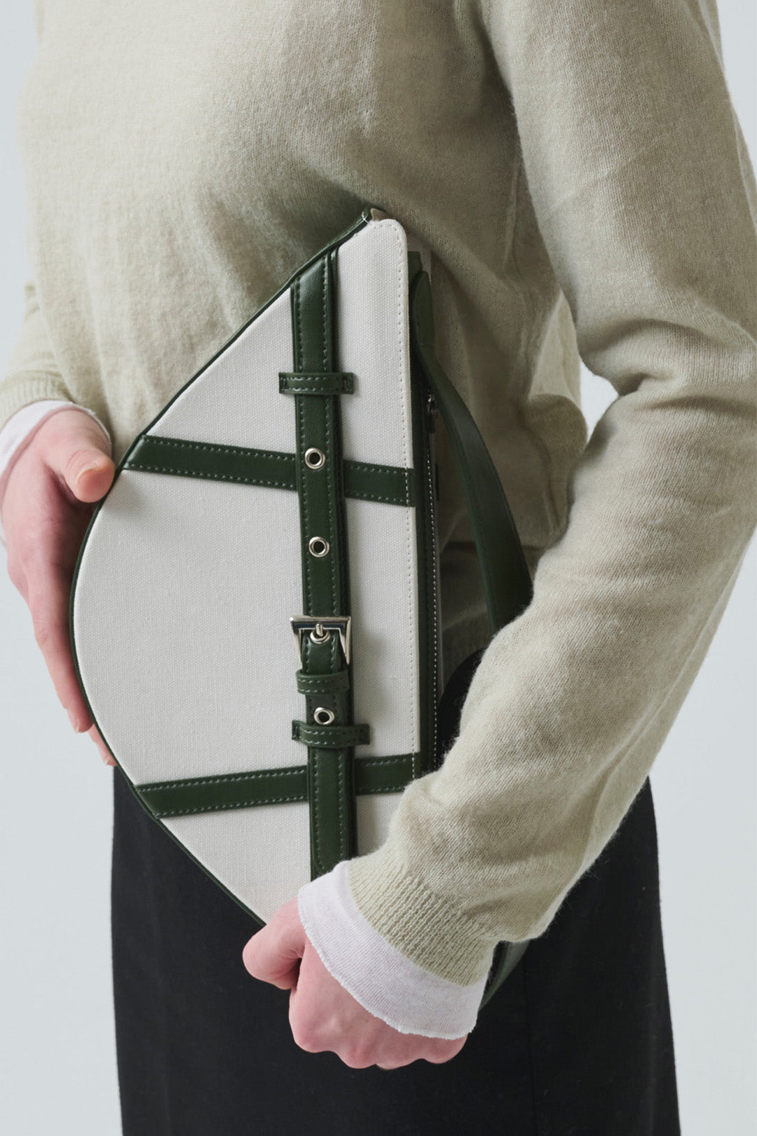 Green LE SAUT GOCHI bag with a compact, stylish design, featuring a small size and versatile shape.