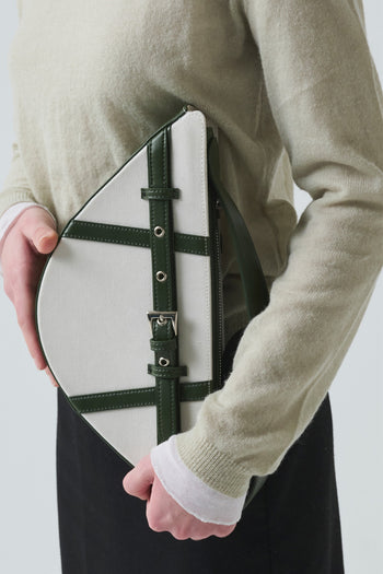 Green LE SAUT GOCHI bag with a compact, stylish design, featuring a small size and versatile shape.