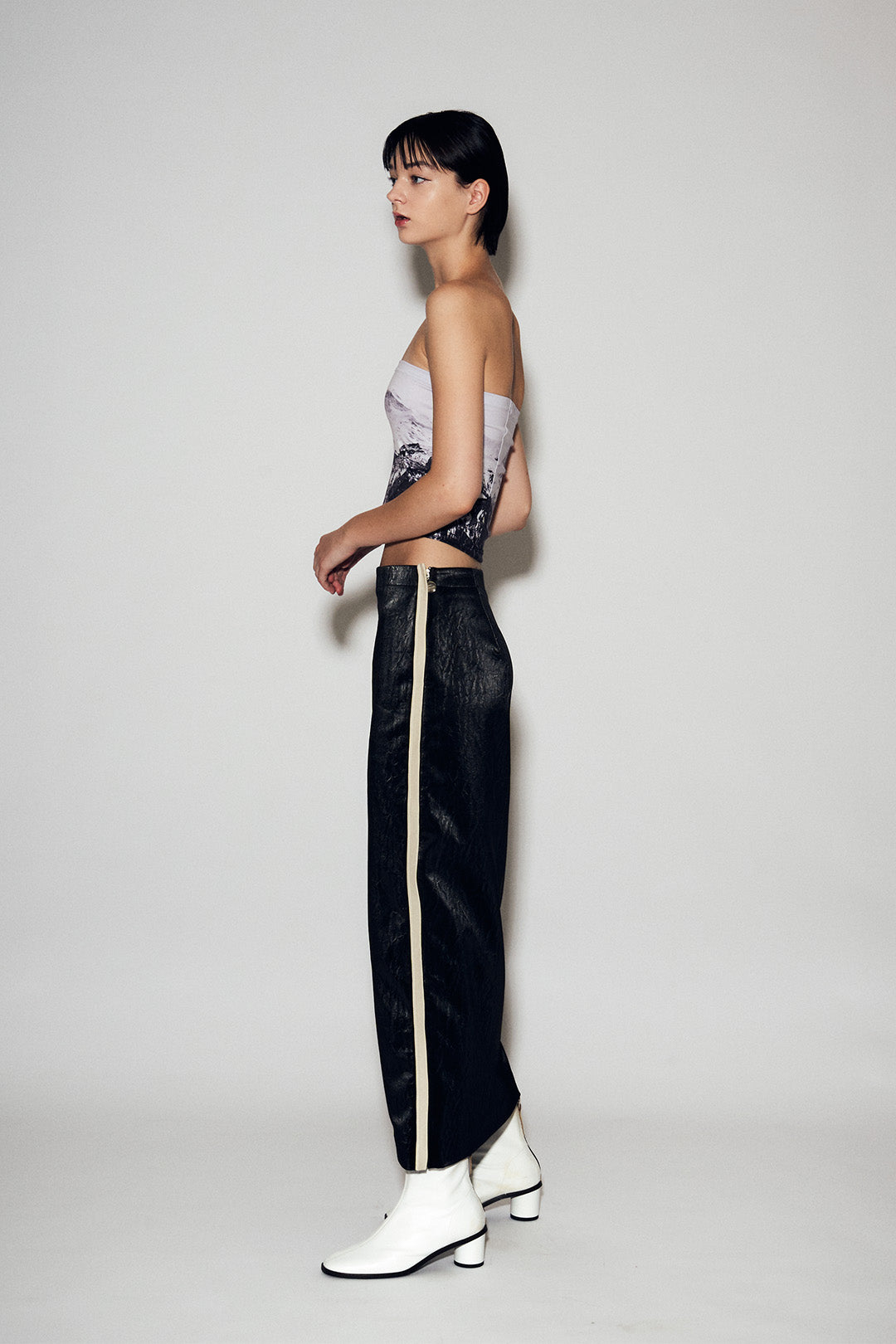 Black Eco Leather H-Line Long Skirt from Lunecave, stylish and elegant bottoms with a sleek, fitted silhouette.