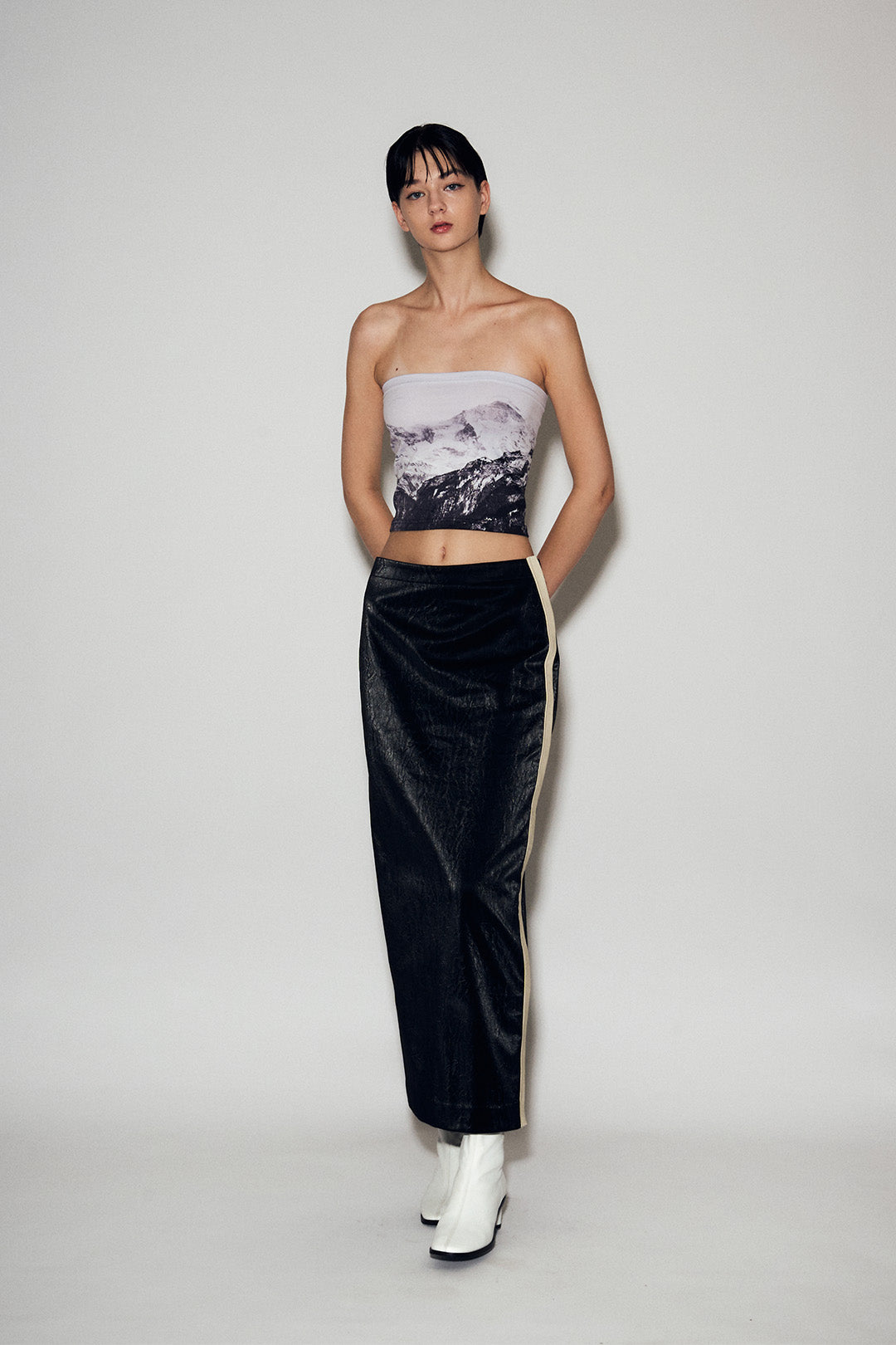 Black eco leather H-line long skirt by Lunecave, stylish and fitted bottoms with a sleek, modern design.