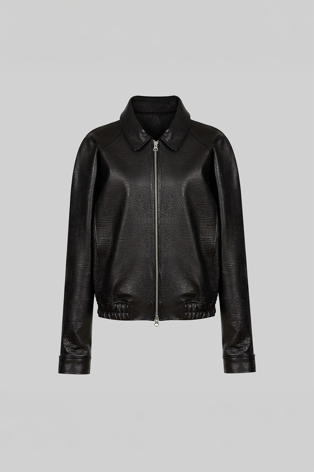 Lunecave black lamb skin raglan jacket displayed on a hanger, showcasing its stylish and sleek design.