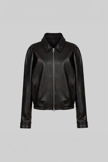 Lunecave black lamb skin raglan jacket displayed on a hanger, showcasing its stylish and sleek design.