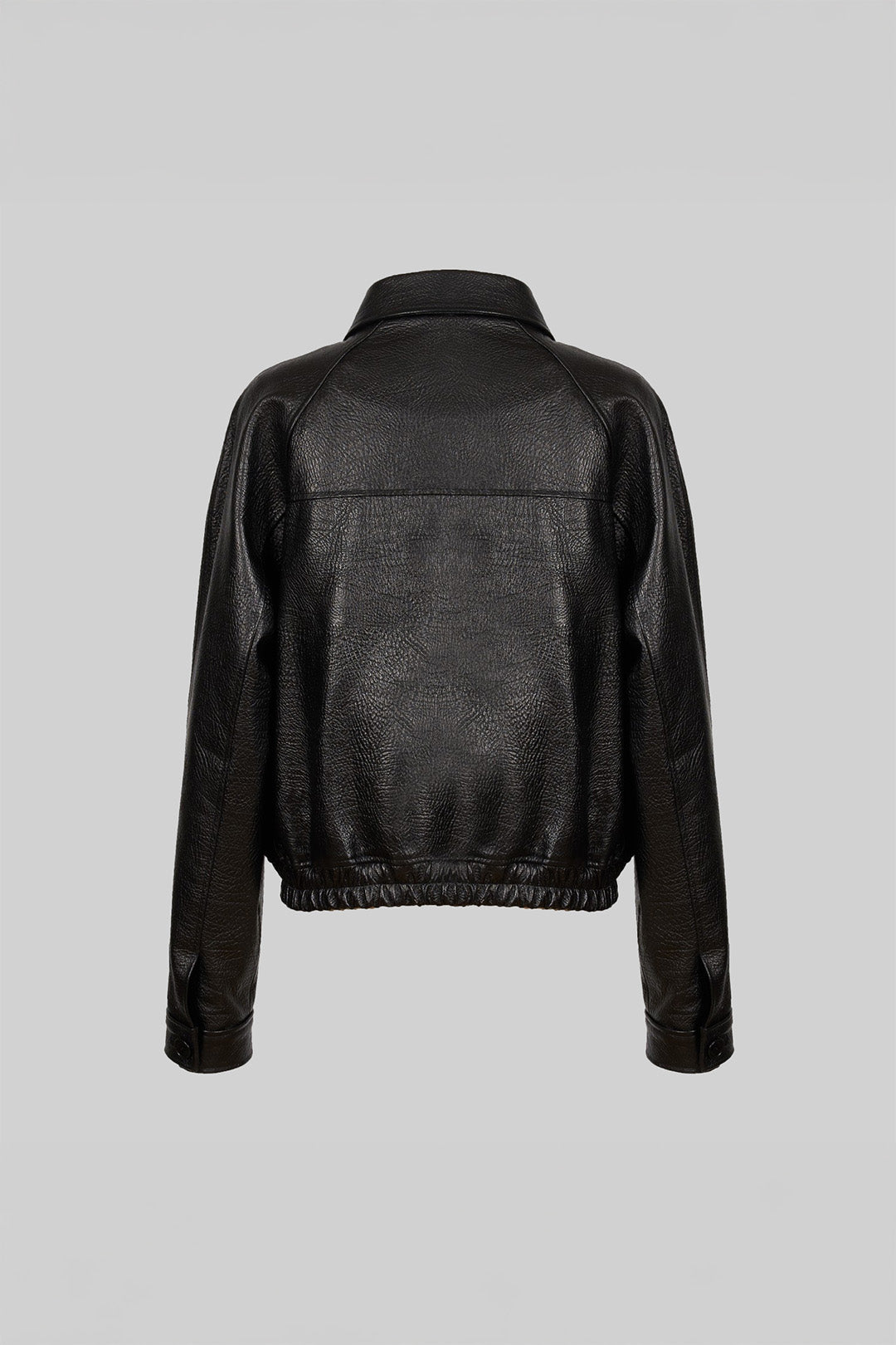 Black lamb skin raglan jacket by Lunecave, showcasing smooth leather texture and relaxed fit in a stylish jacket design.